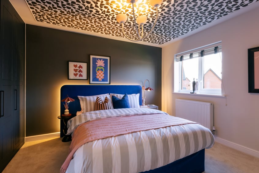 The Whittle show home at Anwyl’s Eagles Green development includes a bold, artsy bedroom with wallpapered ceiling