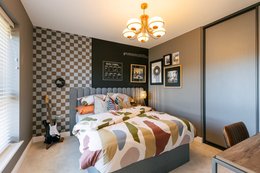 Interior designers have created a bedroom for a music lover in the Whittle show home at Anwyl’s Eagles Green development