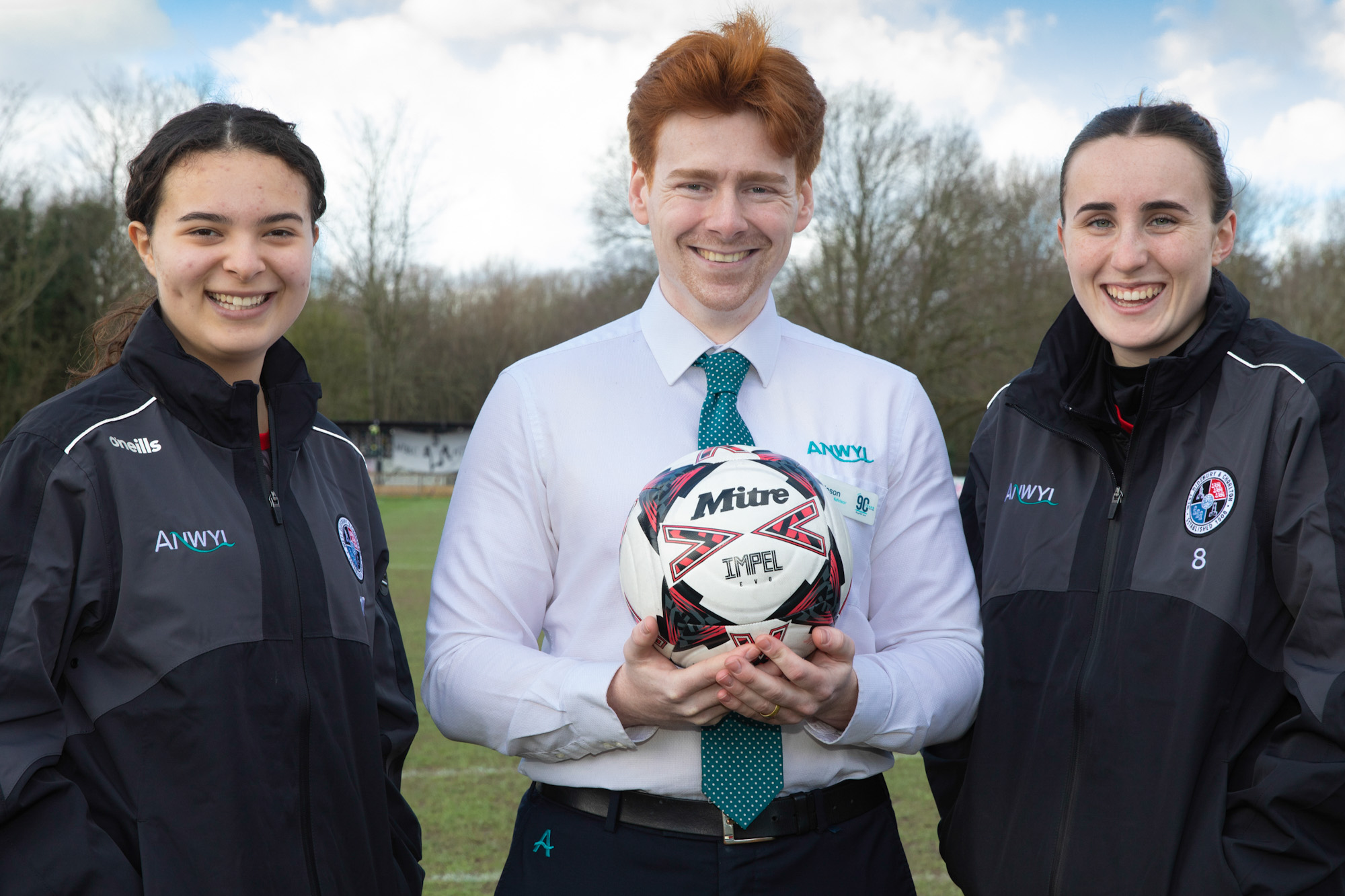 Jason Brereton-Ferns of Anwyl Homes with players Gabriella Rae and Carys Anwyl.