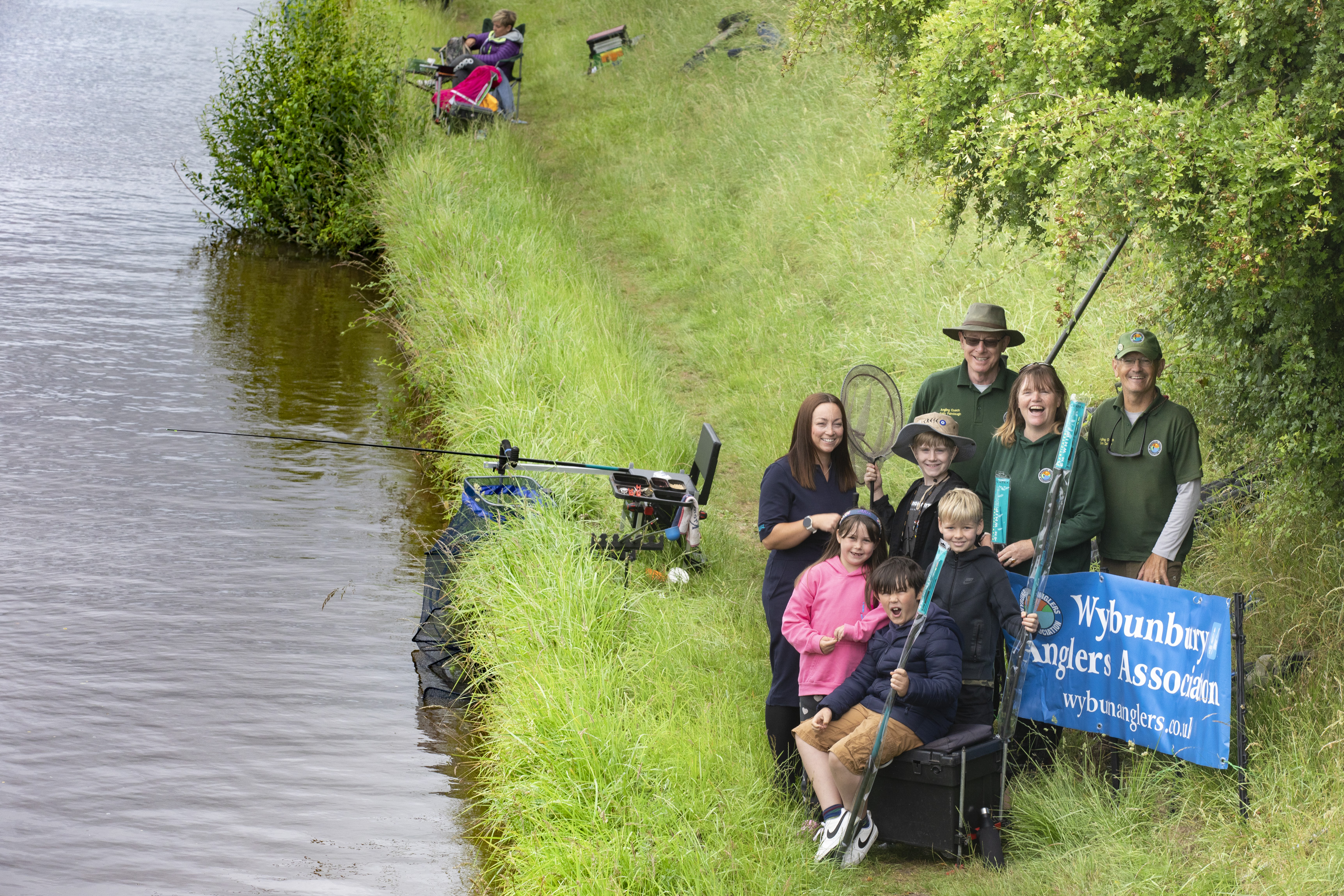 People stood on the canal fishing