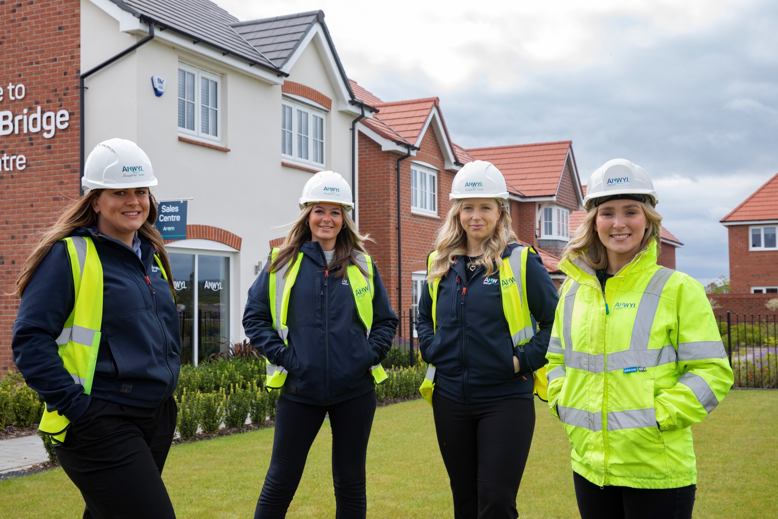 Four women standing outside Anwyl development