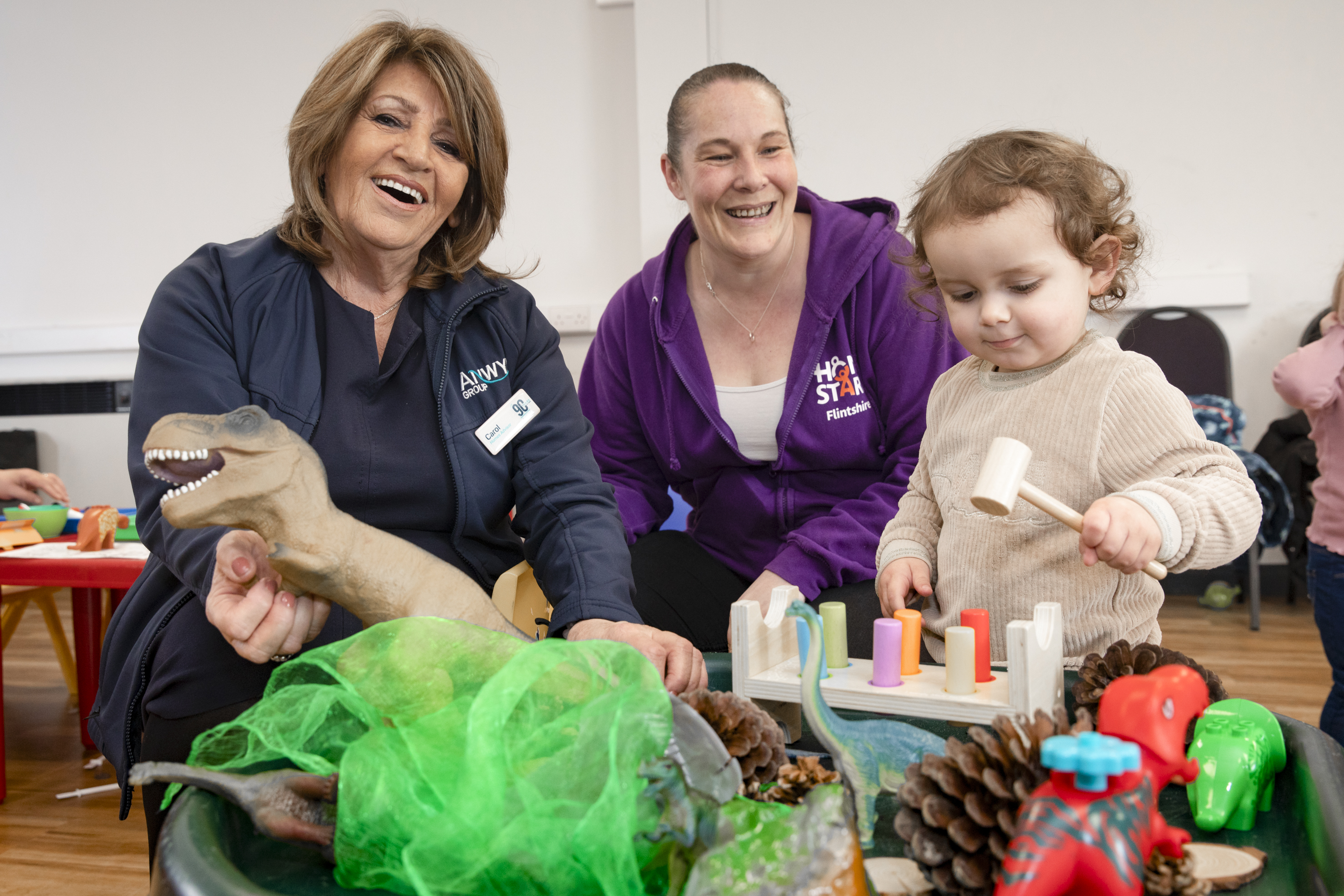 2.	Anwyl Sales Advisor Carol Nomdedeu with Amy Saynor of Home Start, baby Emmie and Lisa Higgins with her son Alfie.