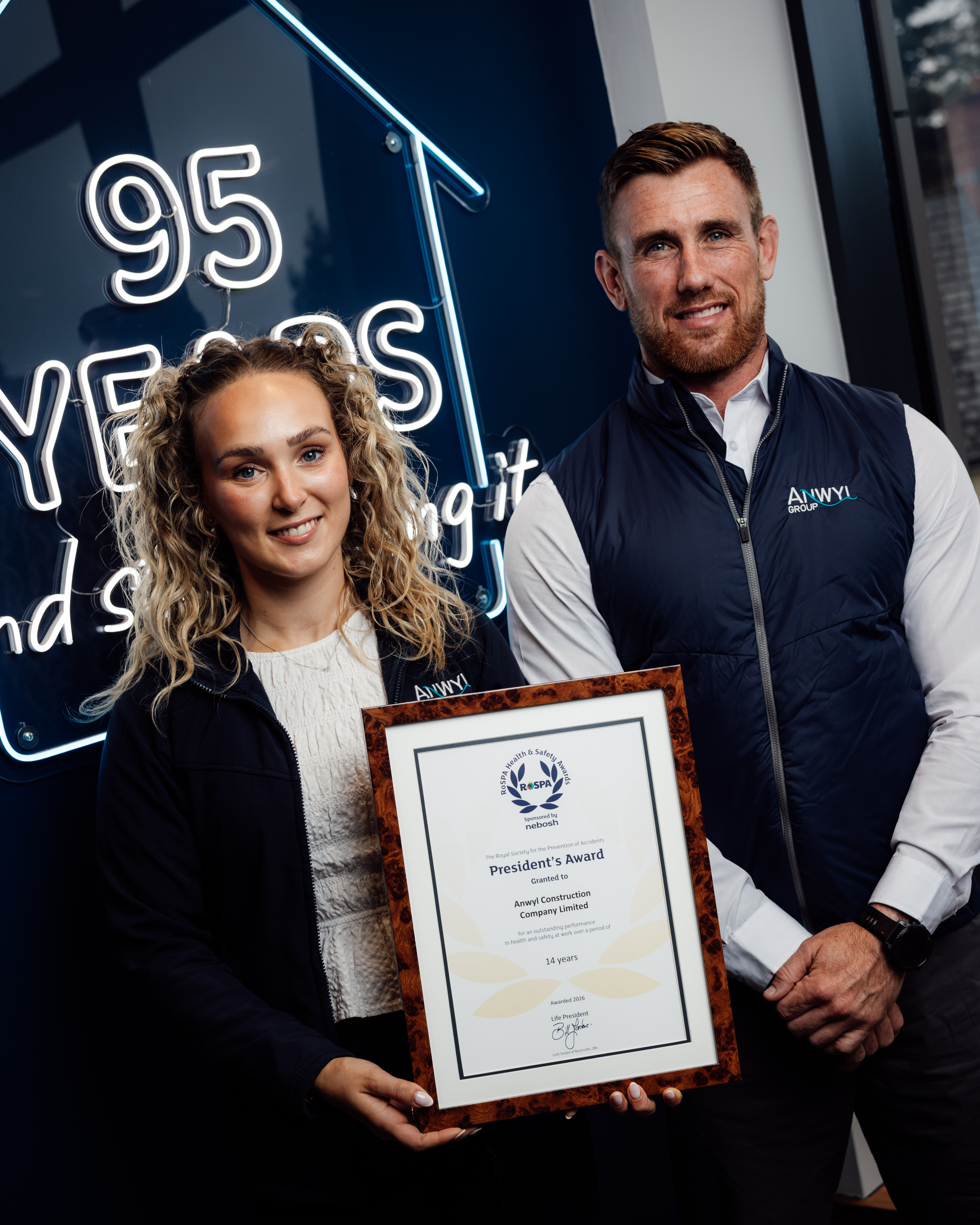 Mather Harrison and Jess Phillips holding ROSPA Gold Award 